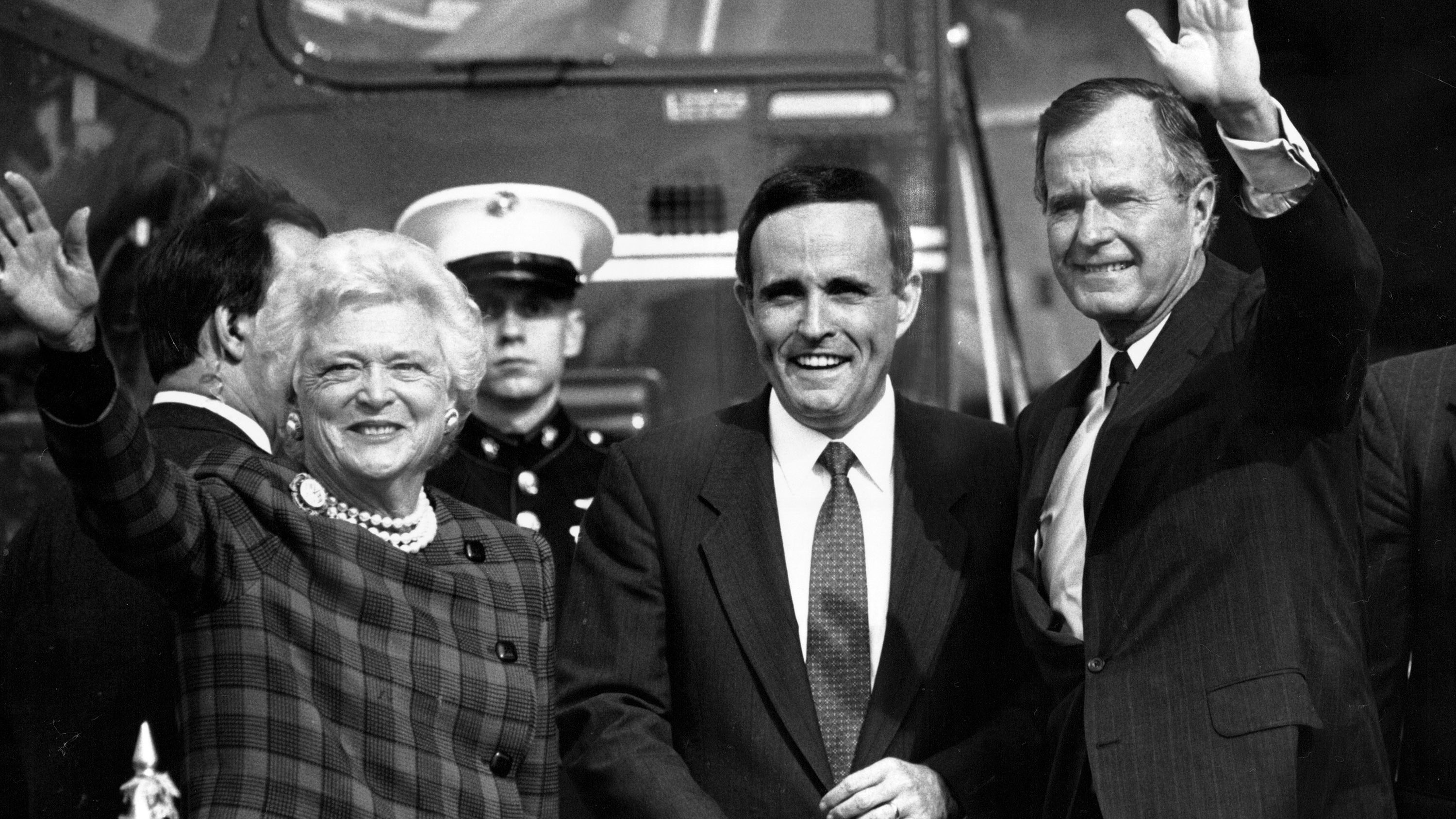 Giuliani greets US President George H.W. Bush and first lady Barbara Bush at a Wall Street heliport in September 1989. Giuliani, who had resigned as US attorney, was running for mayor of New York. He lost a close race to David Dinkins that year, but the two would face off again four years later.
