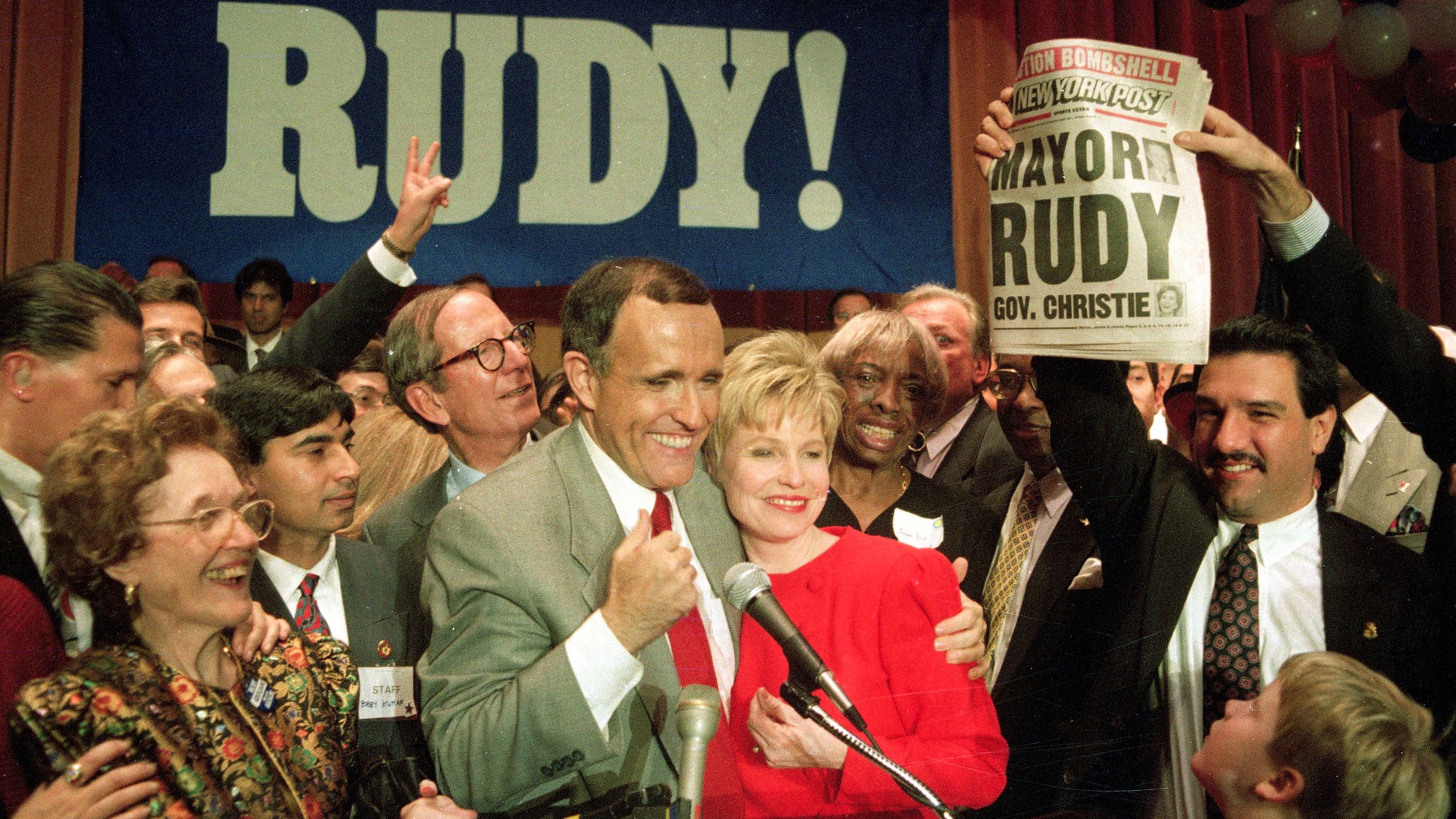 Giuliani hugs his wife, Donna, after defeating Dinkins in a rematch in 1993.