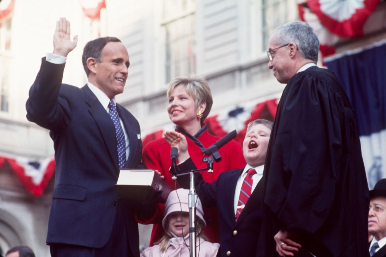Giuliani is sworn in as New York City's mayor in January 1994. Joining him are his wife, Donna, and their children, Andrew and Caroline.