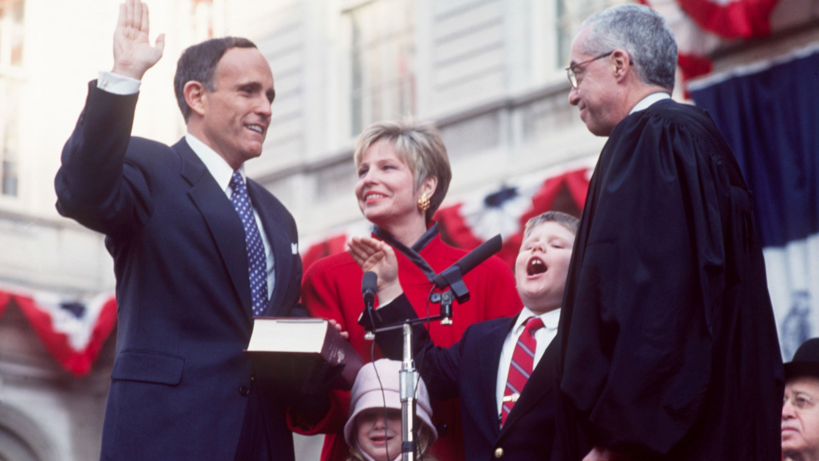 Giuliani is sworn in as New York City's mayor in January 1994. Joining him are his wife, Donna, and their children, Andrew and Caroline.