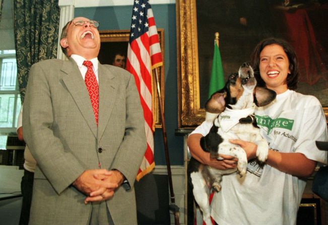 Giuliani laughs as Regal the beagle sings to Dean Martin's "That's Amore" during a mayoral news conference in September 1997.