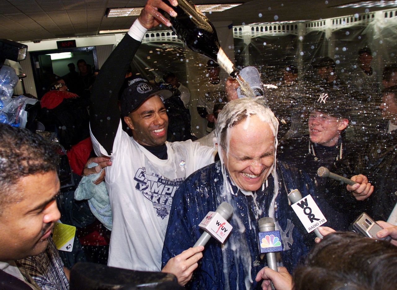 Giuliani gets doused with champagne after the New York Yankees won the American League pennant in October 2000.