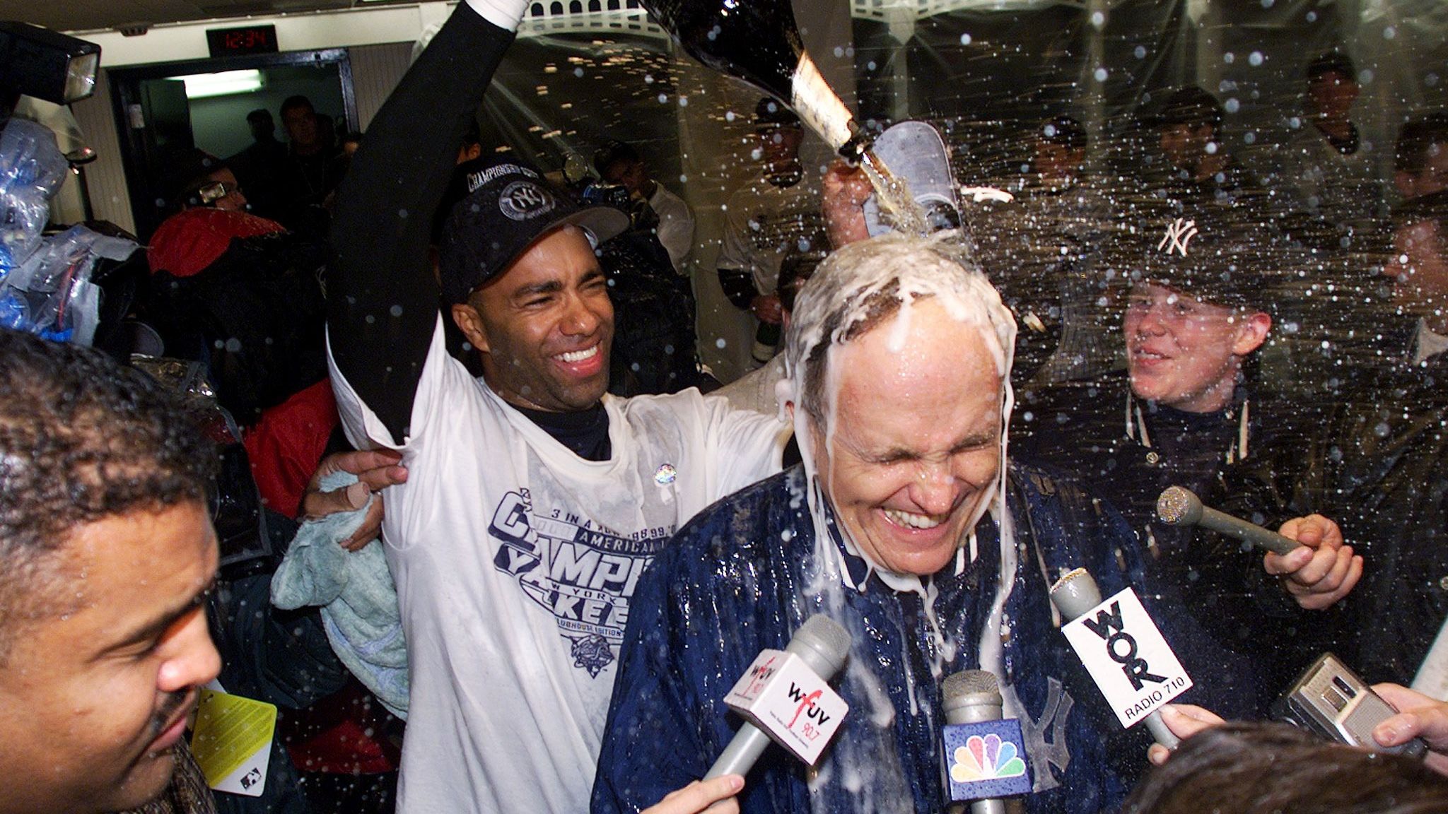 Giuliani gets doused with champagne after the New York Yankees won the American League pennant in October 2000.
