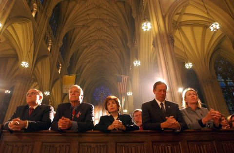 Giuliani, left, prays at St. Patrick's Cathedral a few days after the September 11 attacks. At right is New York Gov. George Pataki and his wife, Libby.