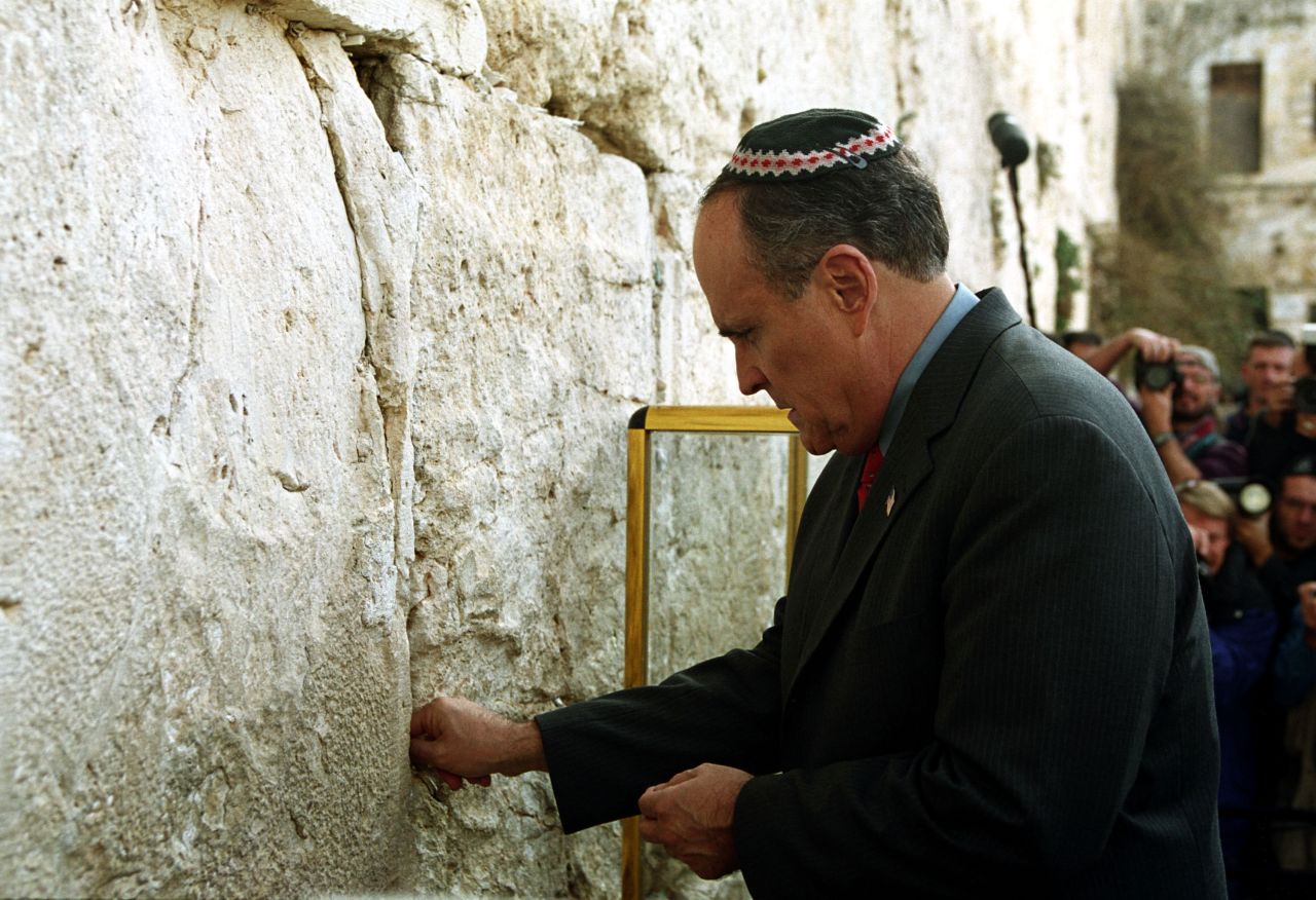 Giuliani touches the Western Wall, Judaism's holiest site, in December 2001. He was visiting as part of a delegation that included Pataki and Mayor-elect Michael Bloomberg.