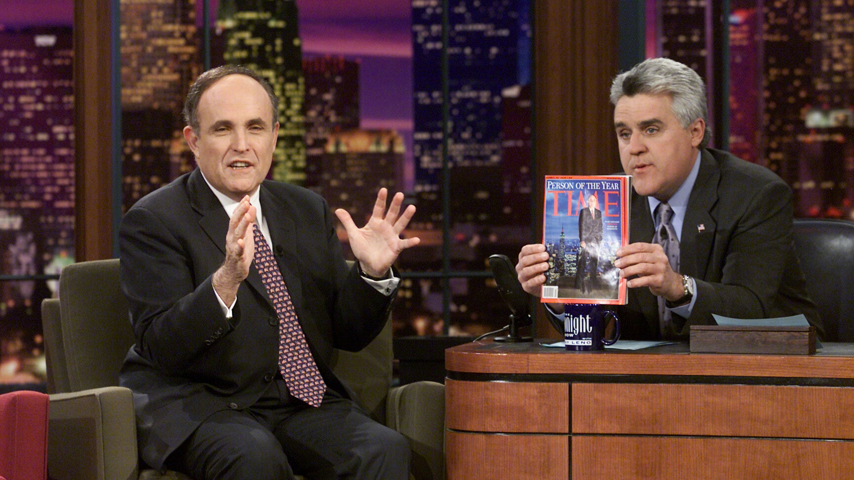 Giuliani is interviewed by talk-show host Jay Leno in January 2002. Leno is holding up the Time magazine that named Giuliani as Person of the Year.
