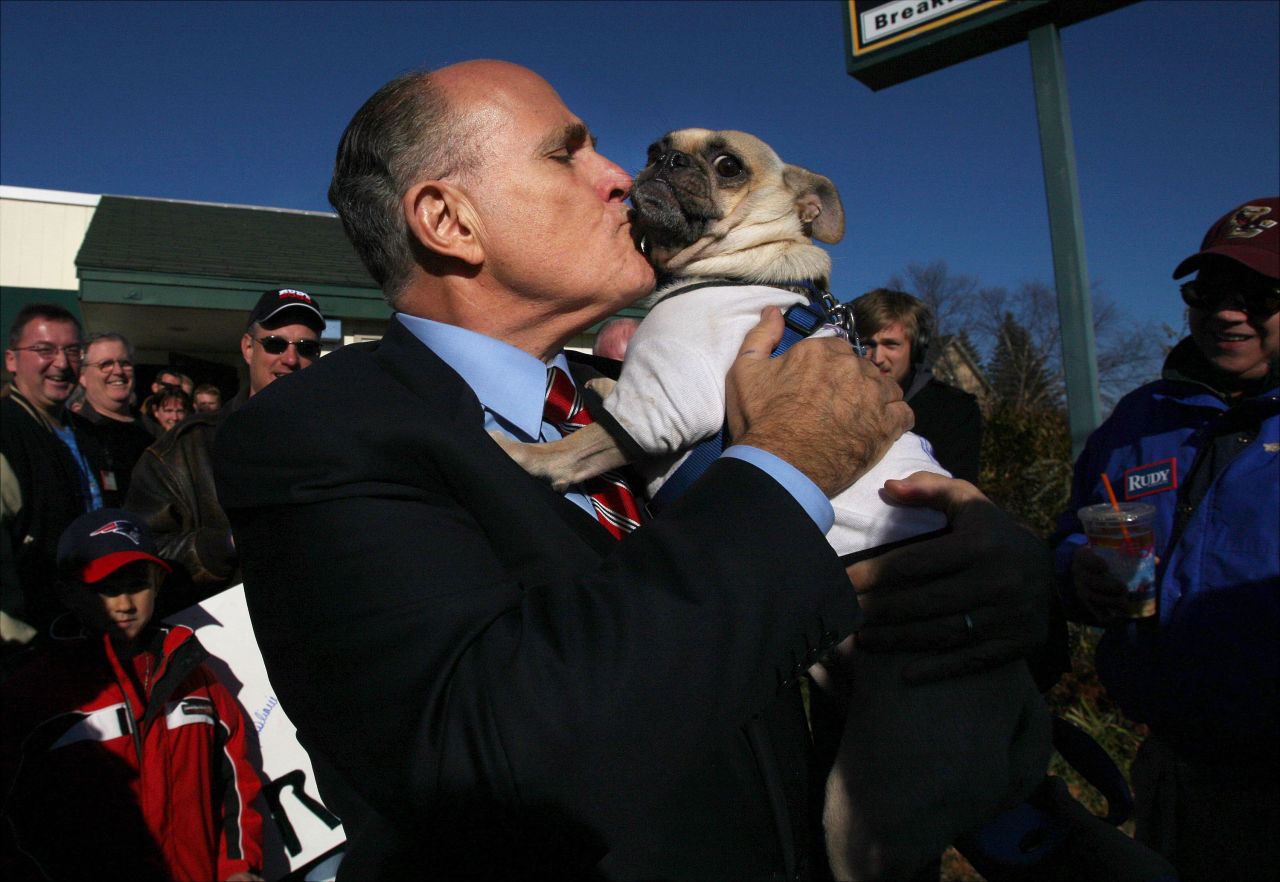 Giuliani kisses Thompson the pug while campaigning in New Hampshire in November 2007. The dog was wearing a shirt that said, "Anybody but Hillary for president."