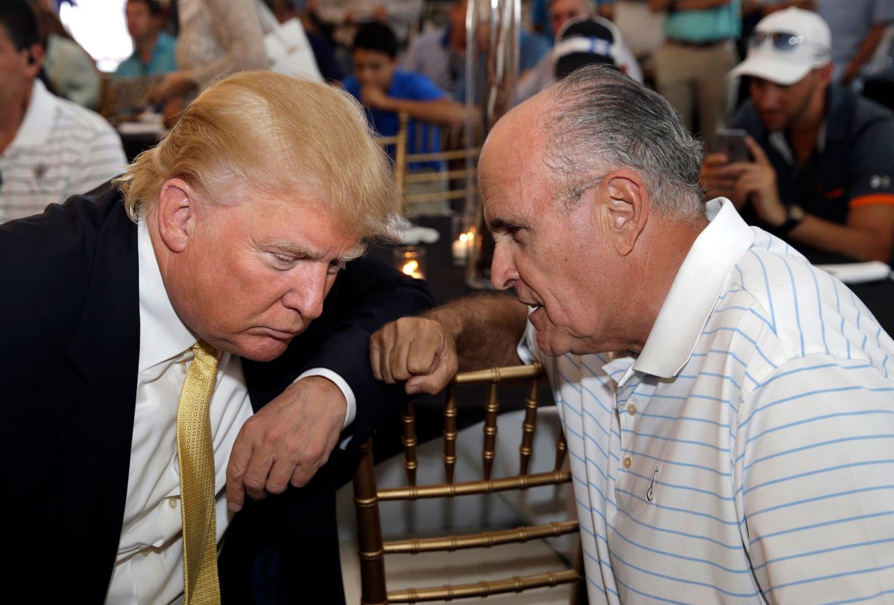 Giuliani talks to Trump at a fundraising event in July 2015. Trump had just announced his presidential campaign a month earlier.
