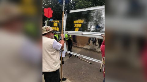 The back of the Hate Shields leaves anti-LGBTQ protesters looking at themselves.
