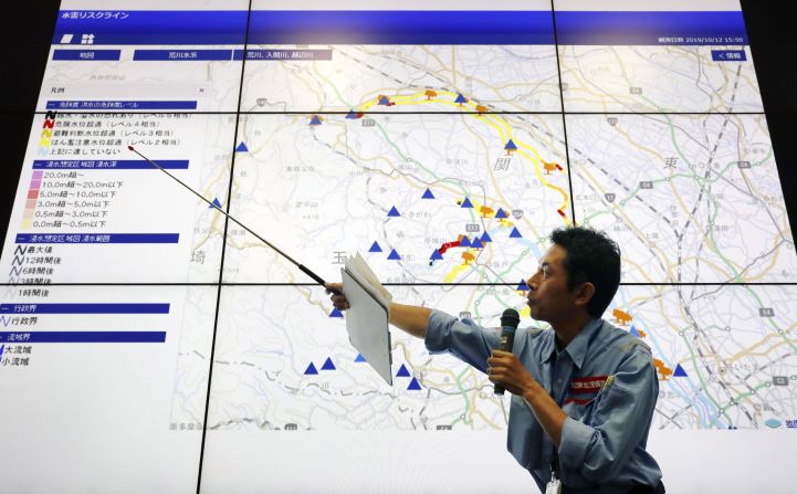 A land ministry official explains effects of Typhoon Hagibis on rivers in Saitama Prefecture during a press conference in Saitama city, near Tokyo, on October 12.