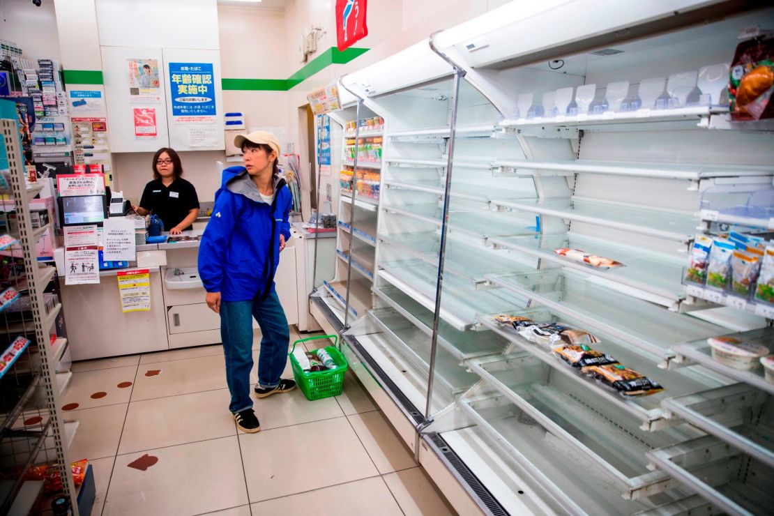 Empty shelves greet shoppers at a convenience store in the Shinagawa district of Tokyo on October 12, 2019, as the effects of Typhoon Hagibis begin to be felt in Japan's capital.