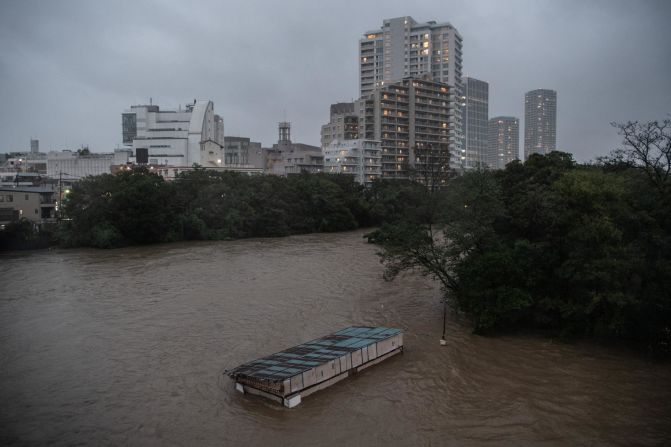 A café is submerged in floodwater from the Tama River in Tokyo on October 12.