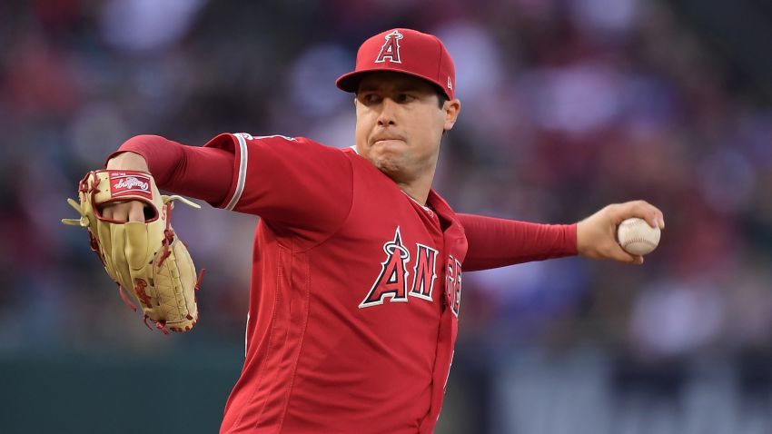 FILE - In this May 25, 2019, file photo, Los Angeles Angels starting pitcher Tyler Skaggs throws during the first inning of a baseball game against the Texas Rangers in Anaheim, Calif. The Angels say they do not know whether a longtime public relations official had been providing drugs to late pitcher Skaggs, as detailed in a report on ESPN's "Outside the Lines." Eric Kay, a 24-year employee of the Angels' PR department, told the Drug Enforcement Agency he had provided opioids to Skaggs and used them with the pitcher for years, according to the ESPN report Saturday, Oct. 12, 2019. Kay reportedly watched as Skaggs snorted three lines of crushed pills in his hotel room in Texas, on the night before he was found dead. (AP Photo/Mark J. Terrill, File)