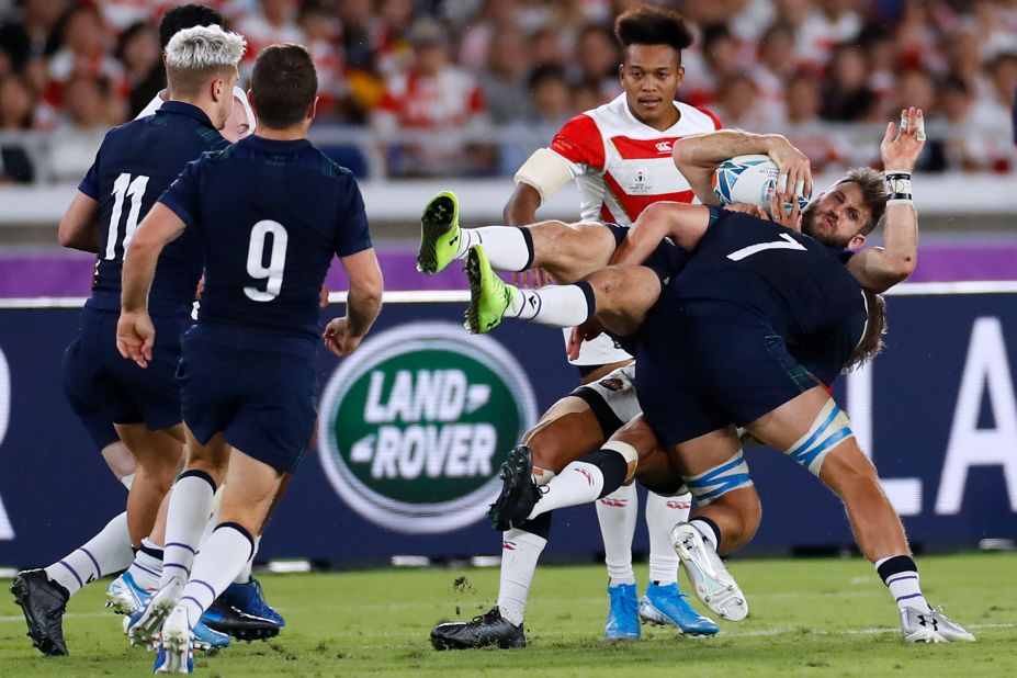 Scotland's wing Tommy Seymour is tackled. Japan beat Scotland 28-21 on home soil to reach their first ever World Cup quarterfinal.