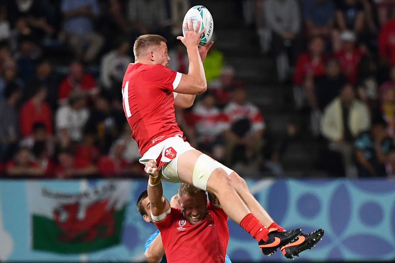 Wales' back row James Davies catches the ball above back row Ross Moriarty during the Pool D match between Wales and Uruguay at the Kumamoto Stadium in Kumamoto, Japan, on Sunday.