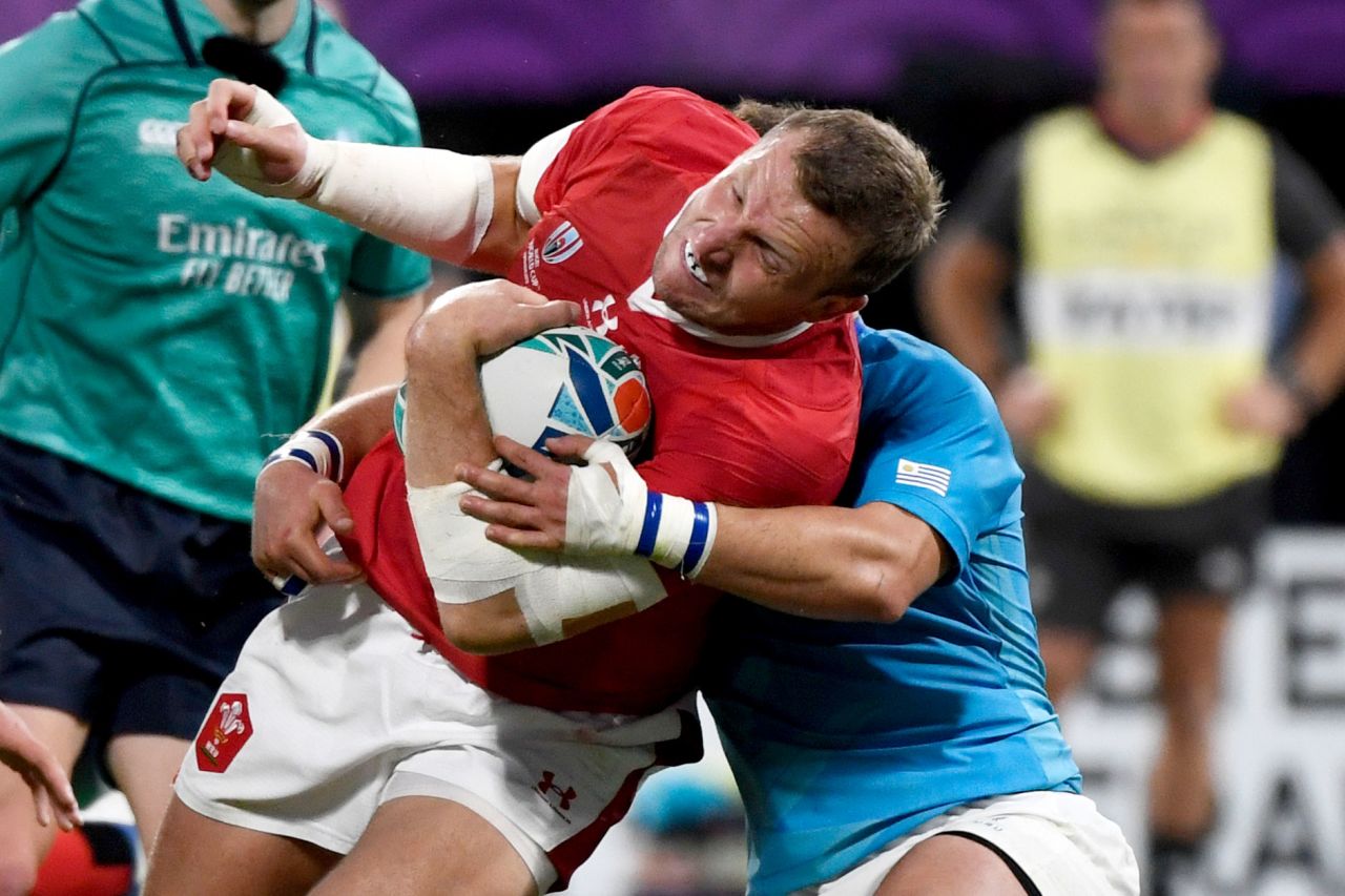 Wales' centre Hadleigh Parkes is tackled.