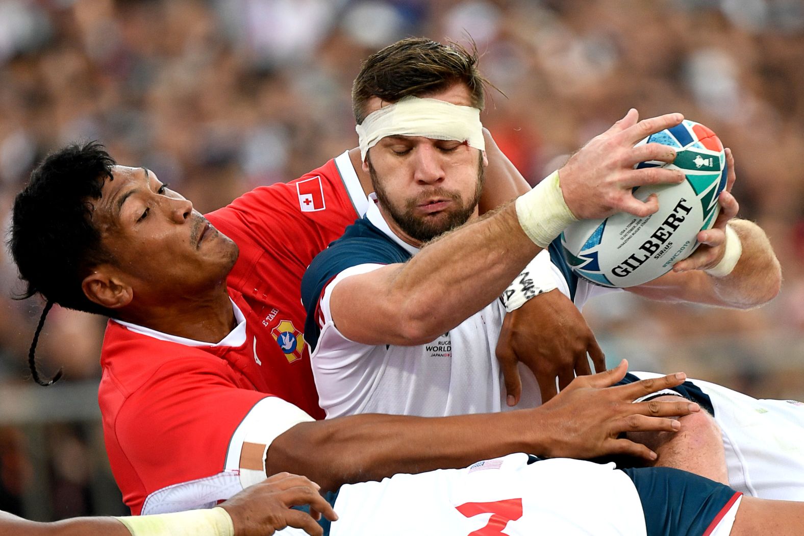 United States' Cam Dolan catches the ball. The United States led the game 12-7 at half-time.