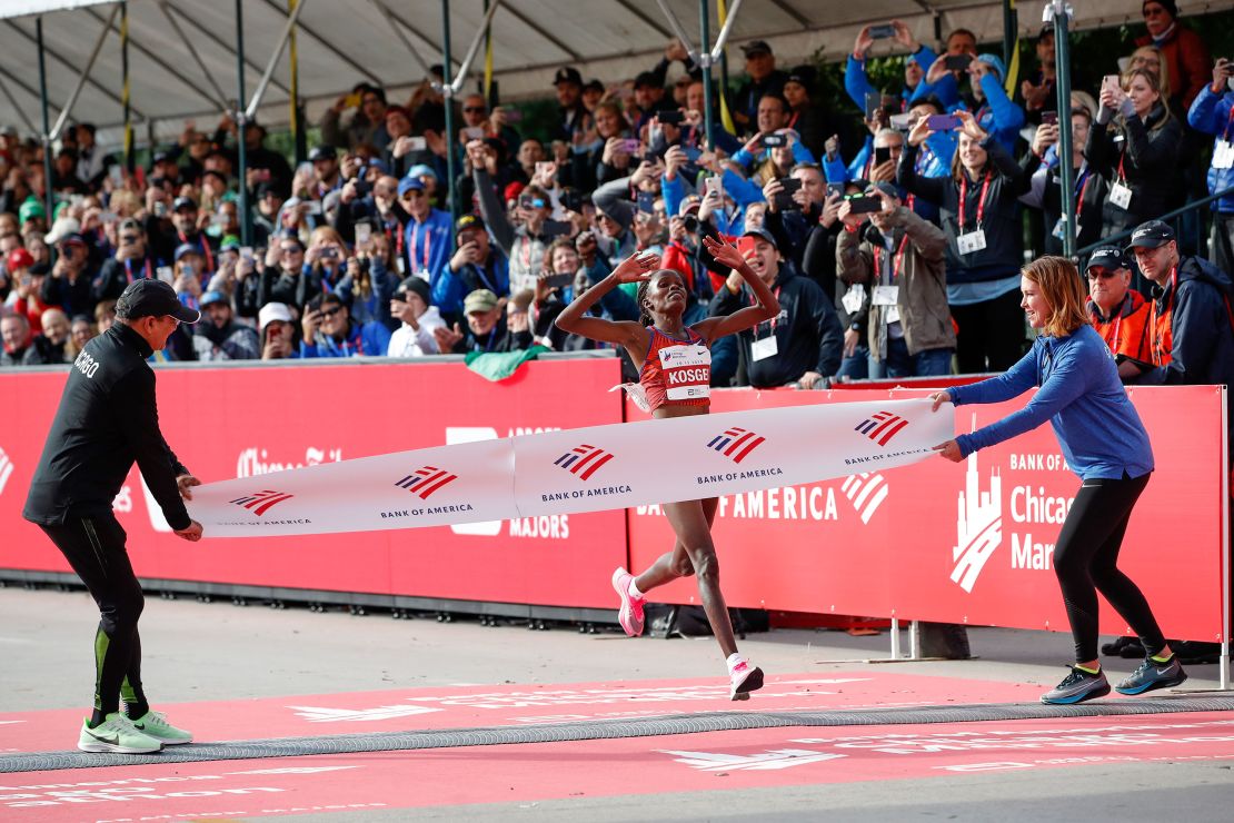 Kenya's Brigid Kosgei crosses the finish line at the Chicago Marathon.