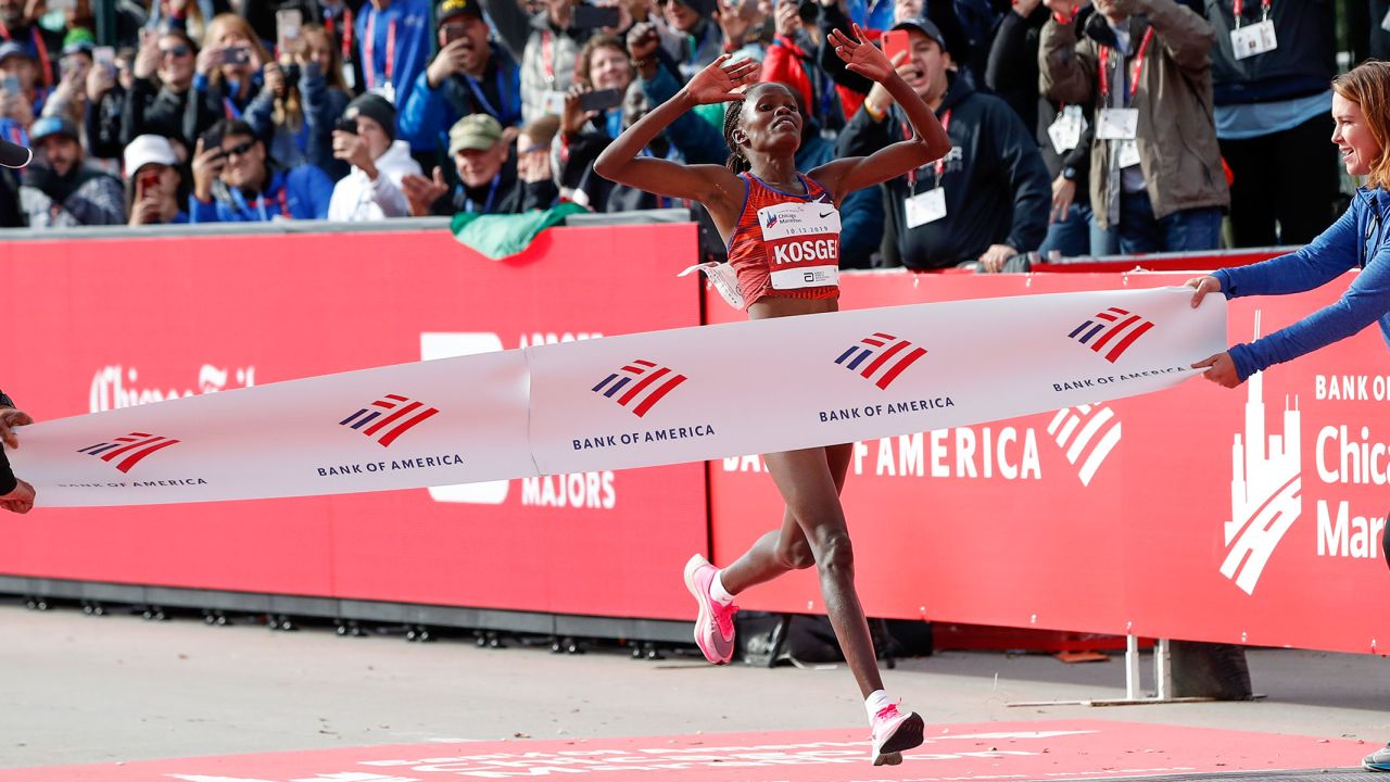 Brigid Kosgei crosses the finish line at the Chicago Marathon with a world record time.