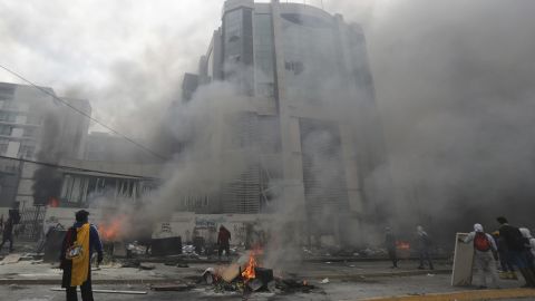 The national auditor's office building burns during clashes between anti-government demonstrators and police in the capital. 