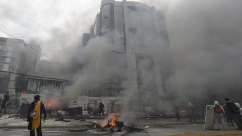The national auditor's office building burns during clashes between anti-government demonstrators and police in the capital.