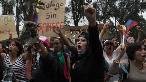 Women march through Quito to demand economic measures taken by Ecuador's President are repealed.