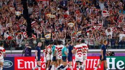 Japan supporters celebrate their team's third try  during the Japan 2019 Rugby World Cup Pool A match between Japan and Scotland at the International Stadium Yokohama in Yokohama on October 13, 2019. (Photo by Odd ANDERSEN / AFP) (Photo by ODD ANDERSEN/AFP via Getty Images)