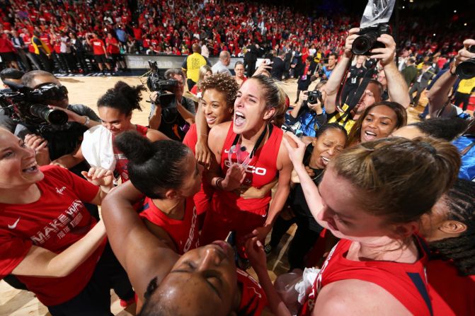 The Washington Mystics celebrate after defeating the Connecticut Sun in Game 5 to win the WNBA title on Thursday, October 10.
