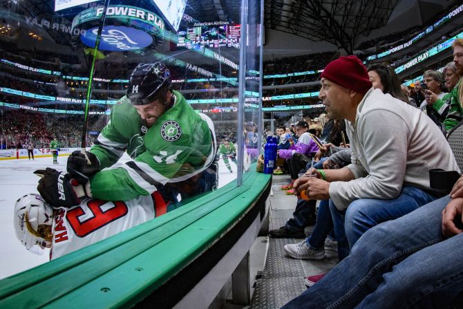 Dallas Stars left wing Jamie Benn checks Washington left wing Carl Hagelin into the boards during the second period of their NHL game in Dallas, Texas, on Saturday, October 12.
