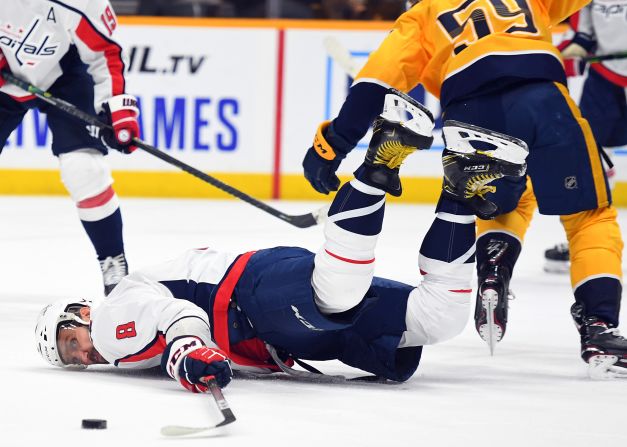 Washington Capitals left wing Alex Ovechkin lands on the ice after being tripped by Nashville defenseman Roman Josi in the second period of their NHL game at Bridgestone Arena, in Nashville, Tennessee, on October 10.