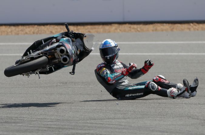 Britain's rider John Mcphee crashes during Thailand's Moto3 at the Chang International Circuit in Buriram, Thailand, on Sunday, October 6.