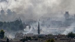 AKCAKALE, TURKEY - OCTOBER 13: Smoke rises over the Syrian town of Tel Abyad, as seen from the Turkish border town of Akcakale on October 13, 2019 in Akcakale, Turkey. The military action is part of a campaign to extend Turkish control of more of northern Syria, a large swath of which is currently held by Syrian Kurds, whom Turkey regards as a threat. U.S. President Donald Trump granted tacit American approval to this campaign, withdrawing his country's troops from several Syrian outposts near the Turkish border. (Photo by Burak Kara/Getty Images)