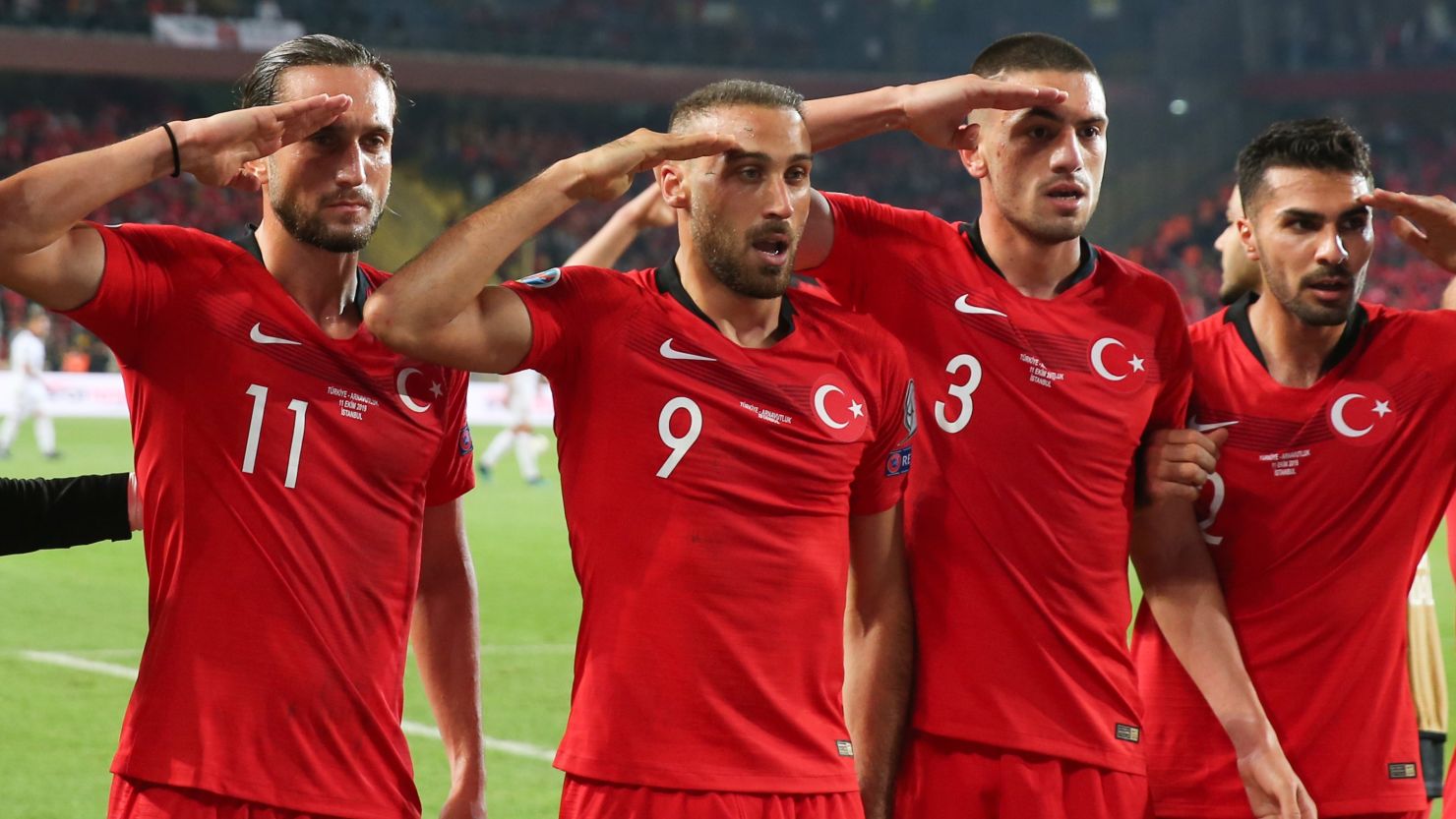 Turkish players perform a military salute after Cenk Tosun's winning goal against Albania.