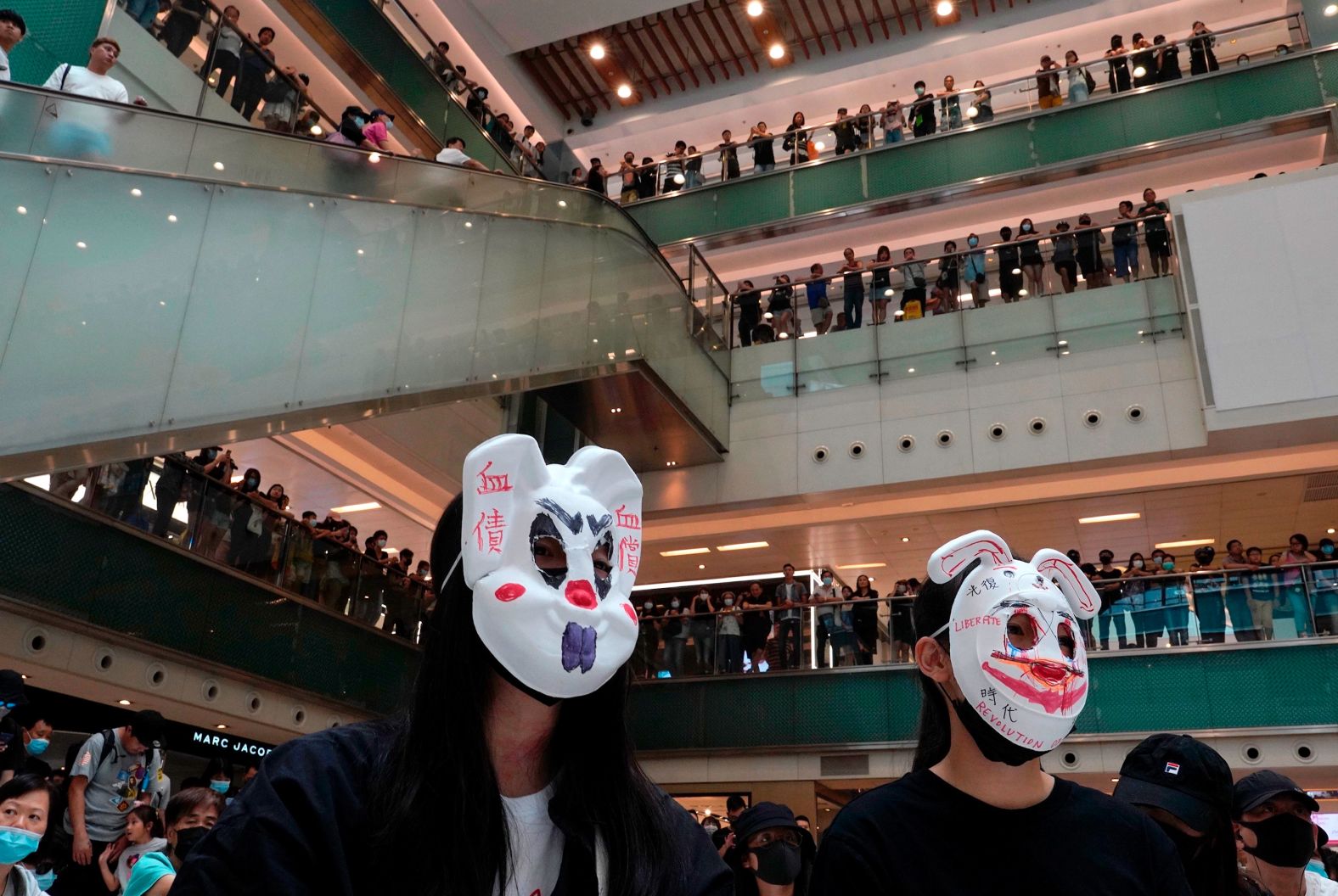 Protesters wearing masks in defiance of <a href="index.php?page=&url=https%3A%2F%2Fwww.cnn.com%2F2019%2F10%2F04%2Fasia%2Fhong-kong-face-mask-ban-meeting-intl-hnk%2Findex.html" target="_blank">a recently imposed ban</a> gather at a shopping mall on October 13.