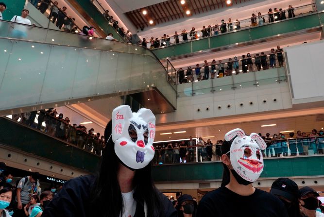 Protesters wearing masks in defiance of <a href="index.php?page=&url=https%3A%2F%2Fwww.cnn.com%2F2019%2F10%2F04%2Fasia%2Fhong-kong-face-mask-ban-meeting-intl-hnk%2Findex.html" target="_blank">a recently imposed ban</a> gather at a shopping mall on October 13.
