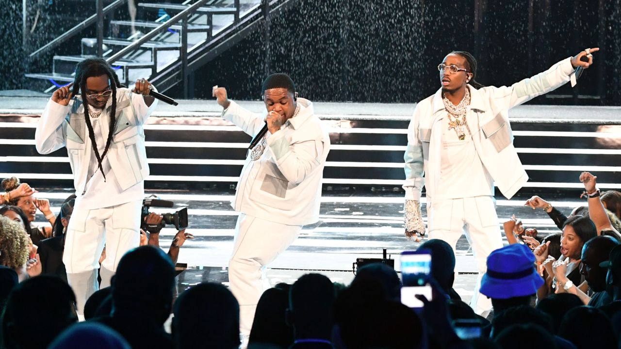 From left, Takeoff, DJ Mustard and Quavo perform at the BET Awards in Los Angeles in 2019.