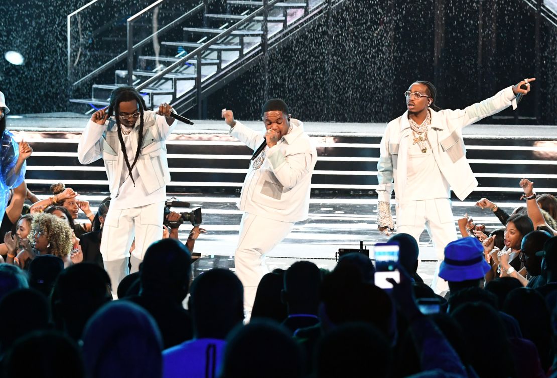 From left, Takeoff, DJ Mustard and Quavo perform at the BET Awards in Los Angeles in 2019.