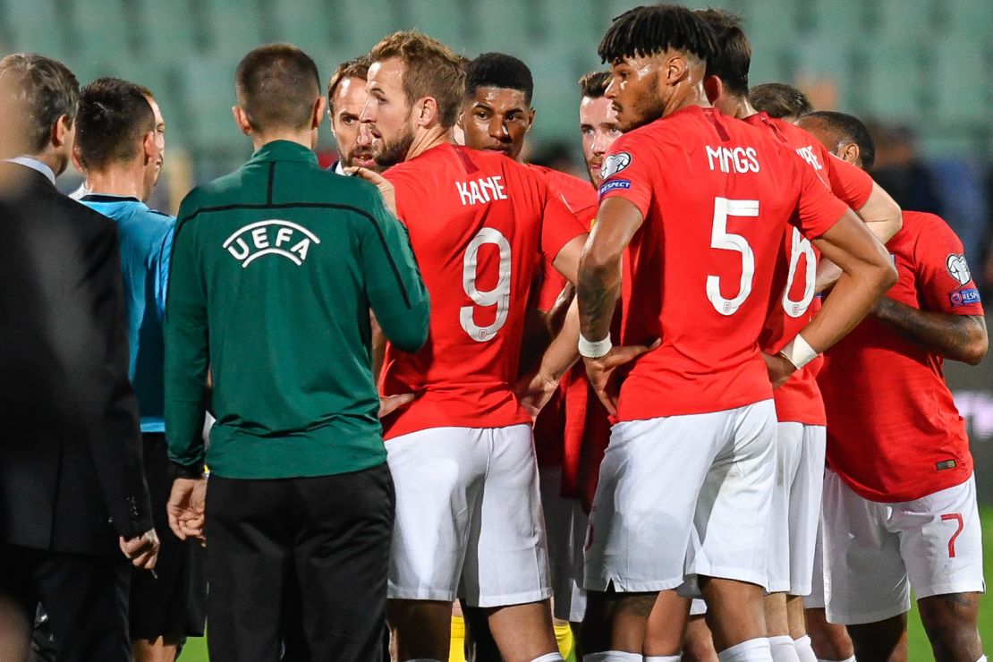 England's forward Harry Kane speaks with the referees during a temporary interruption of the Euro 2020 match between Bulgaria and England.