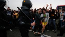 Protesters clash with Spanish policemen on the highway leading to El Prat airport in Barcelona on October 14, 2019 as thousands of angry protesters took to the streets after Spain's Supreme Court sentenced nine Catalan separatist leaders to between nine and 13 years in jail for sedition over the failed 2017 independence bid. - As the news broke, demonstrators turned out en masse, blocking streets in Barcelona and elsewhere as police braced for what activists said would be a mass response of civil disobedience. (Photo by Pau Barrena / AFP) (Photo by PAU BARRENA/AFP via Getty Images)