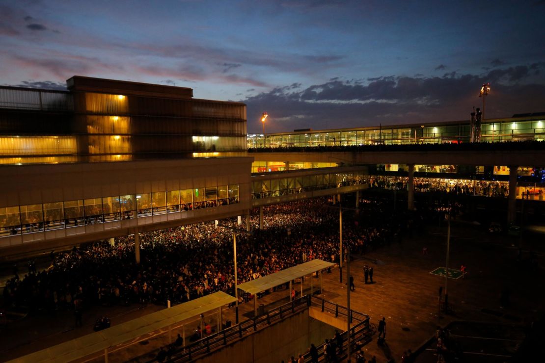 Protesters gather outside El Prat airport in Barcelona on October 14.