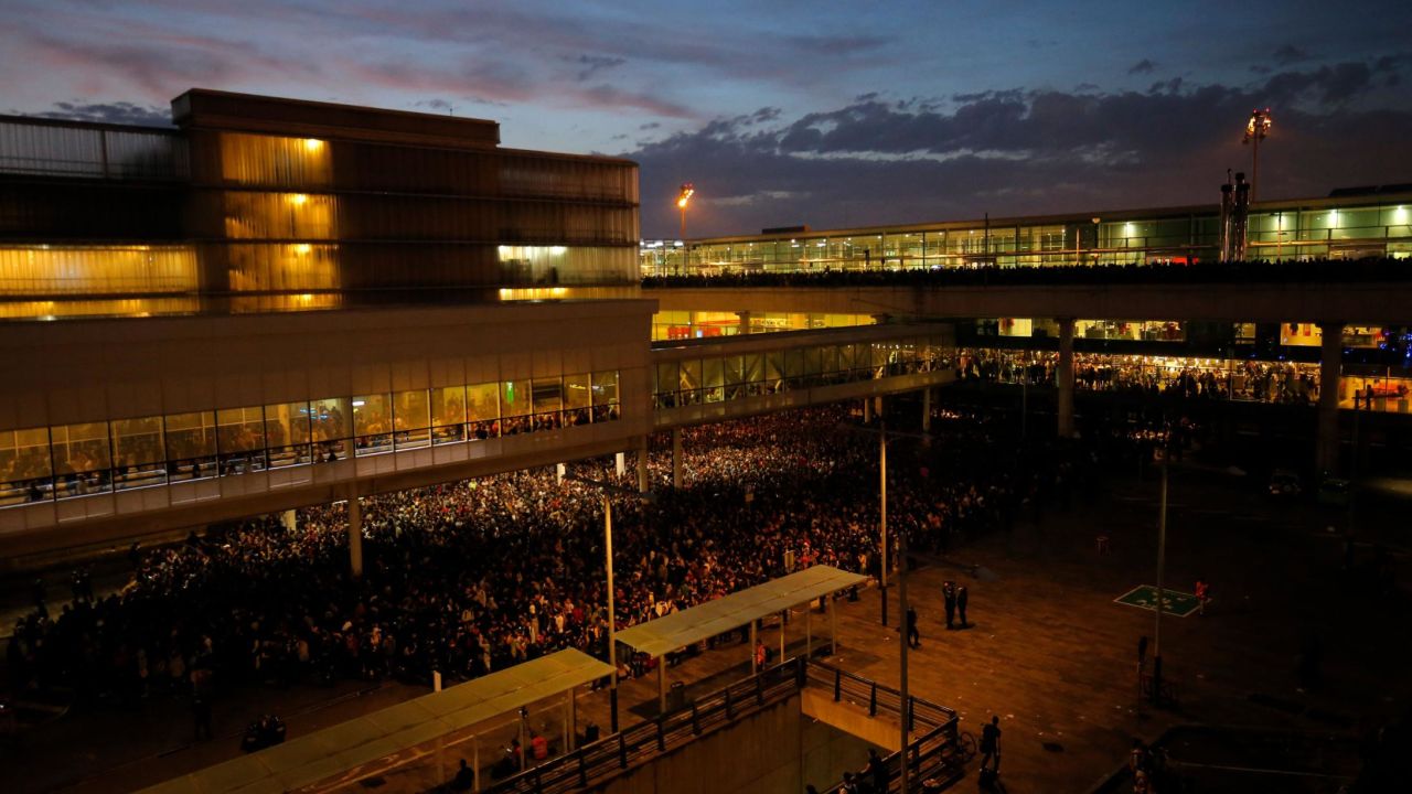 Protesters gather outside El Prat airport in Barcelona on October 14, 2019.