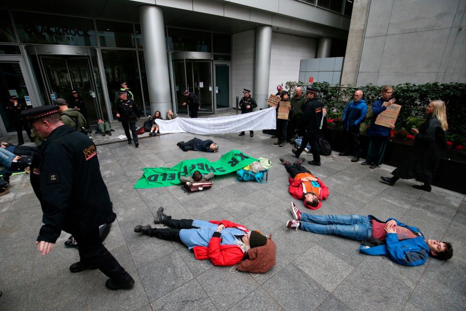Protesters demonstrate outside the BlackRock headquarters in Throgmorton Avenue in London on Monday, October 14.