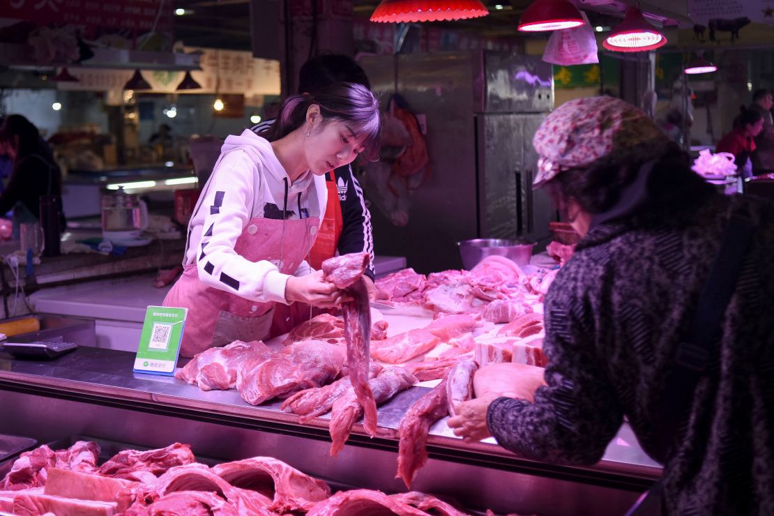 A vendor sells pork at a market in Beijing on October 15, 2019. China's consumer inflation accelerated at its fastest pace in almost six years in September as African swine fever sent pork prices soaring nearly 70 percent, official data showed on October 15.
