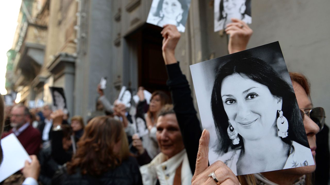 People outside a church in Valletta, Malta, after a mass in memory of Caruana Galizia. 