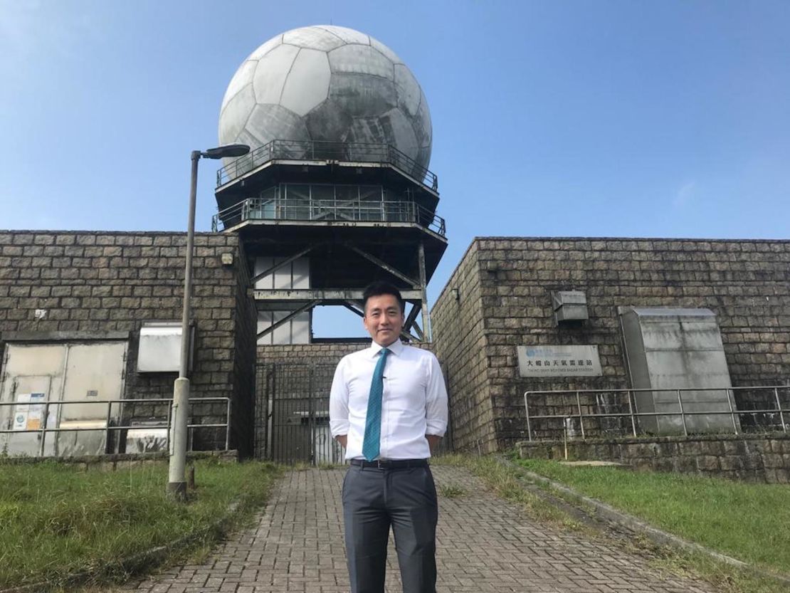 Ray Kong, a scientific officer at the Hong Kong Observatory, in front of the Tai Mo Shan weather radar. It is perched atop Hong Kong's tallest peak.