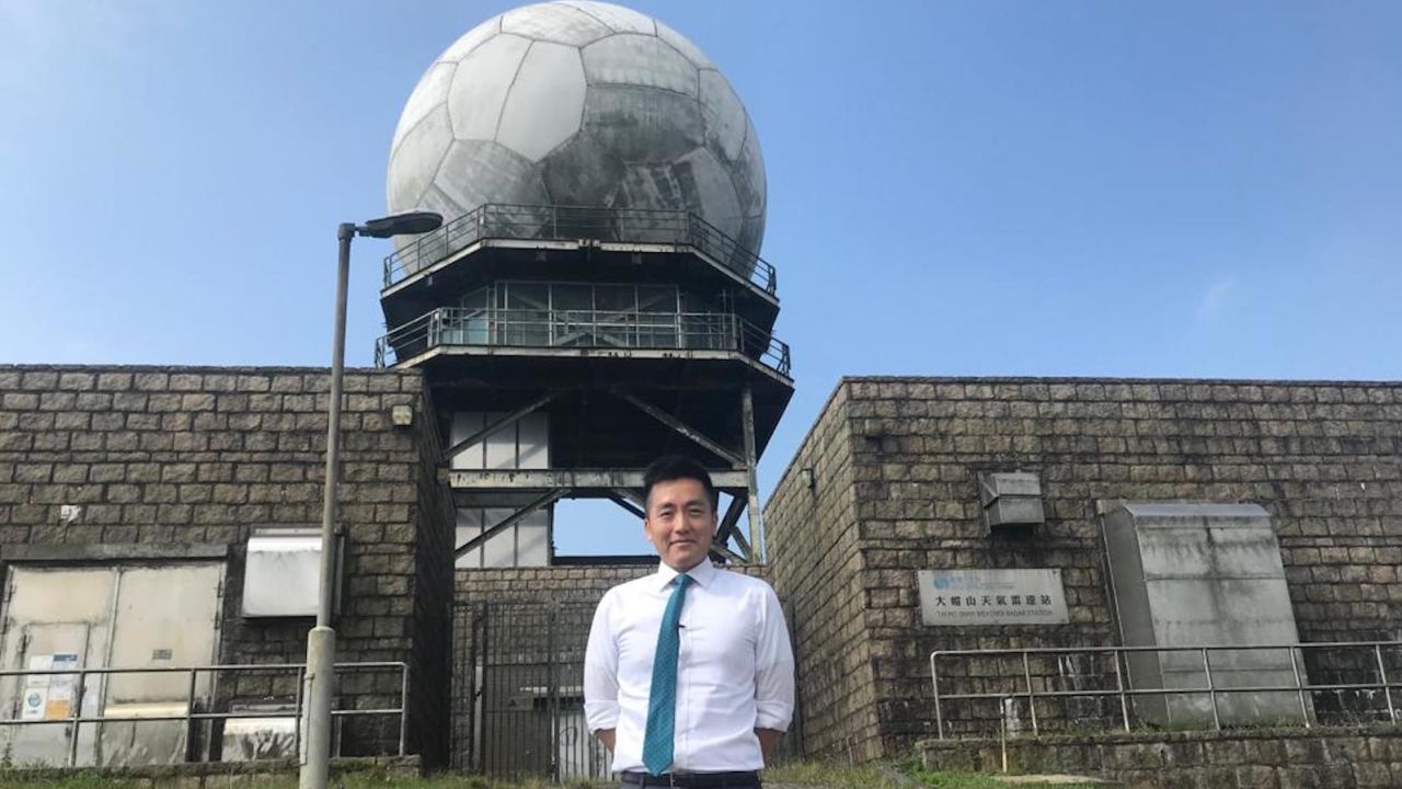 Ray Kong, a scientific officer at the Hong Kong Observatory, in front of the Tai Mo Shan weather radar. It is perched atop Hong Kong's tallest peak.