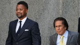 Oscar-winning actor Cuba Gooding Jr. (L), departs his court arraignment  with his lawyer  Mark Hellerin (C) New York October 15, 2019, in New York on October 15, 2019. - Gooding has previously been charged with forcible touching and sex abuse in relation to an alleged groping incident at a New York bar. (Photo by TIMOTHY A. CLARY / AFP) (Photo by TIMOTHY A. CLARY/AFP via Getty Images)