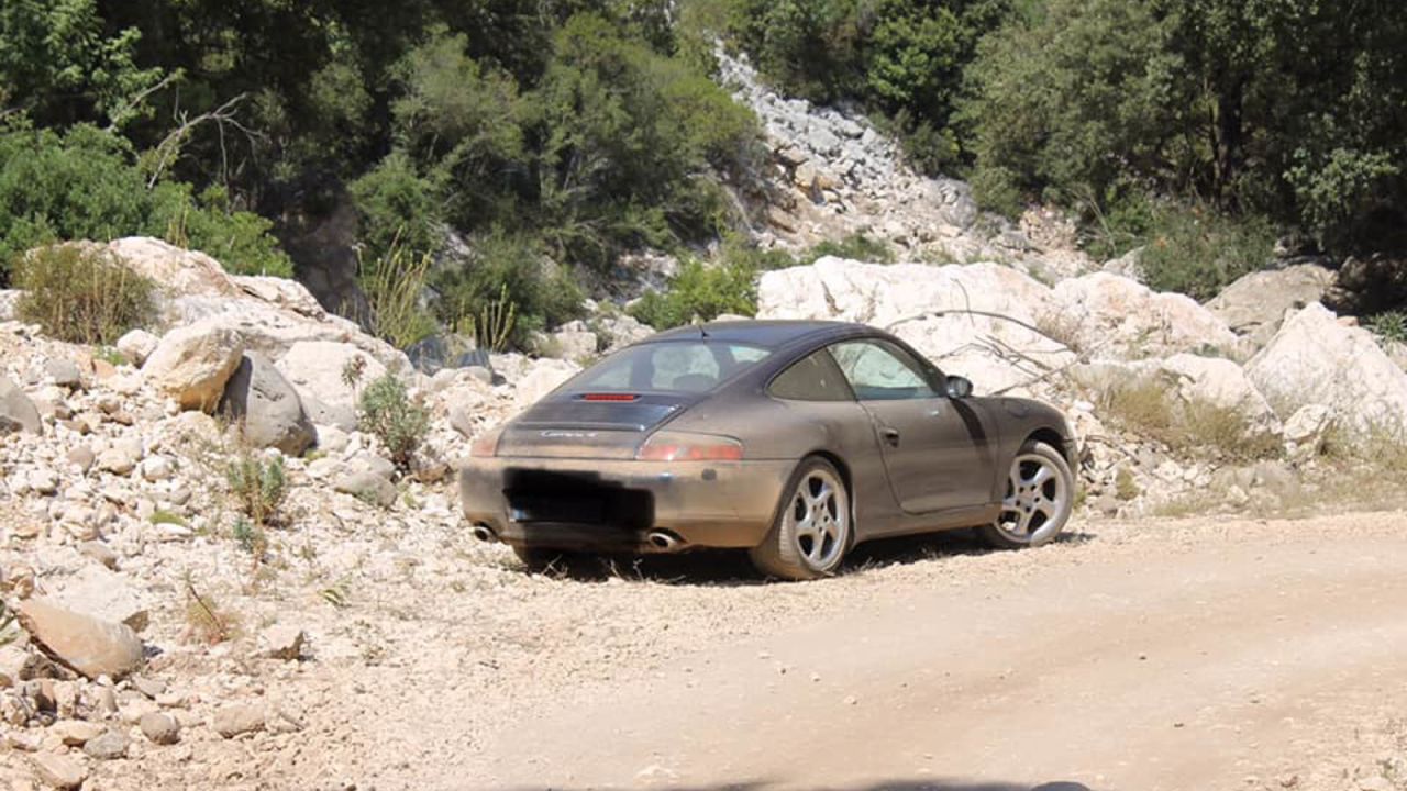 <strong>Final straw:</strong> This Porsche stuck on a mountain track was what caused authorities to erect the signs.