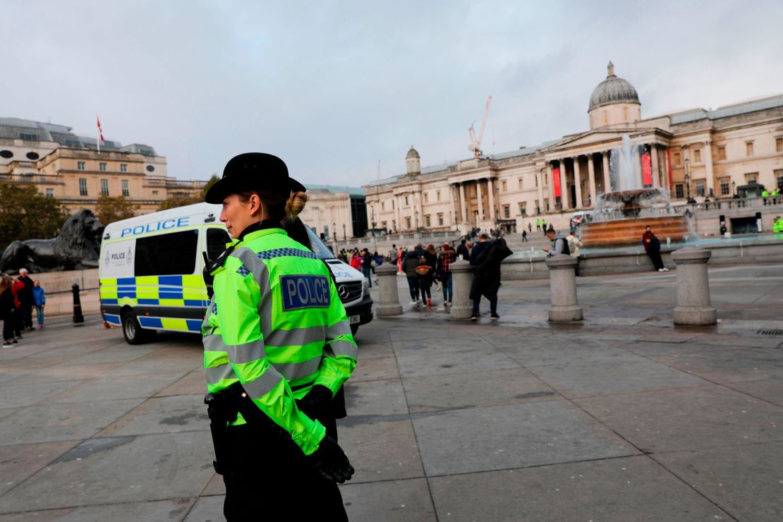 Police officers deployed around Trafalgar Square after the  Extinction Rebellion protest camp was cleared overnight.