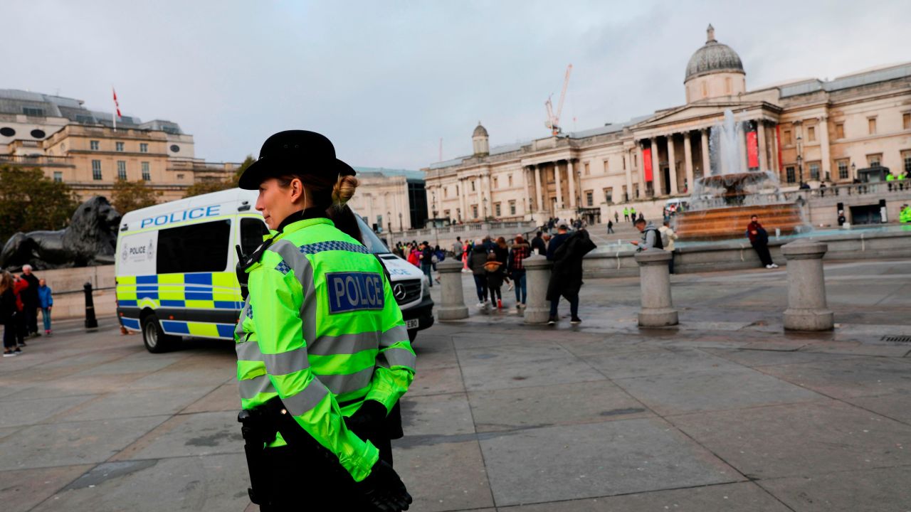 Police officers are seen deployed around Trafalgar Square in London, on October 15, 2019, after the  Extinction Rebellion protest camp was cleared overnight from the Square and as demonstrations by the climate change action group enter a ninth day. - Activists from the environmental pressure group Extinction Rebellion defiantly vowed to continue their planned two-week campaign of demonstrations in central London on October 15, despite a police ban. (Photo by ISABEL INFANTES / AFP) (Photo by ISABEL INFANTES/AFP via Getty Images)